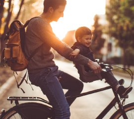 A father with his son on a bike